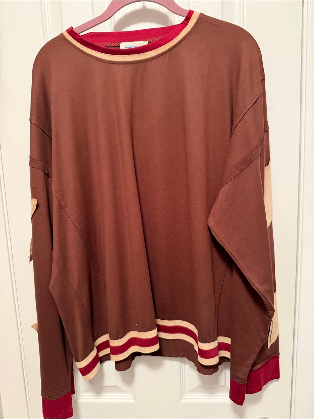 Like new women’s size large top. with stars on the sleeves